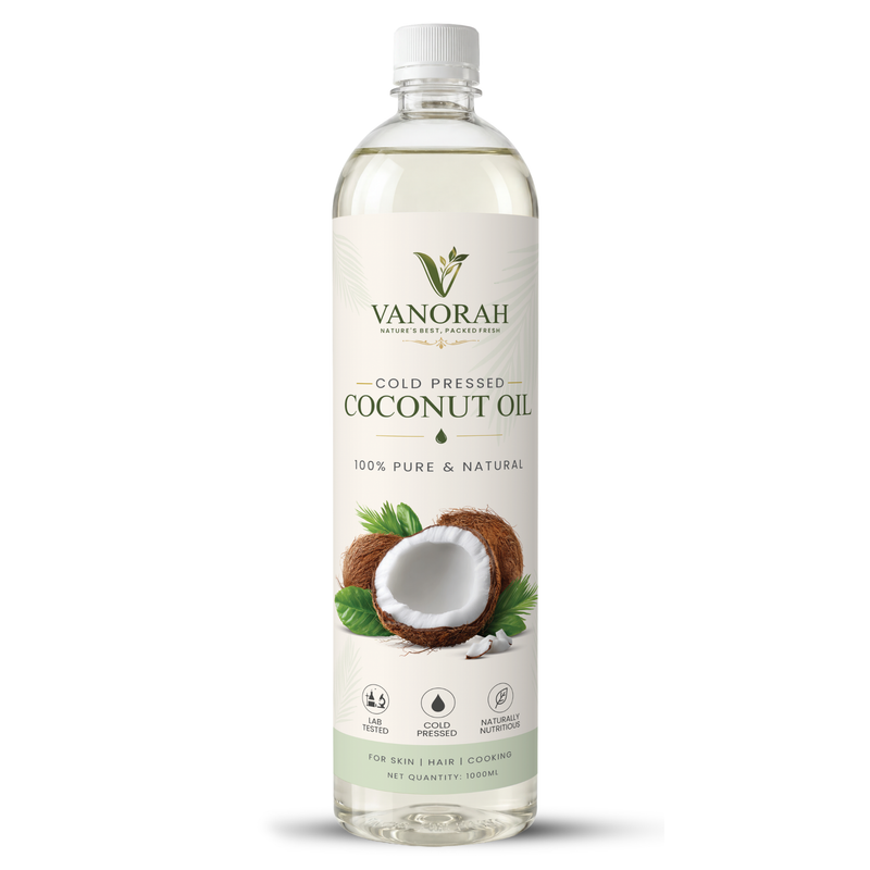 A 1000 ml clear plastic bottle of Vanorah Cold Pressed Coconut Oil, featuring a white label with green and brown coconut graphics, on a white background.