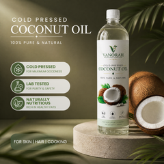 A bottle of Vanorah Cold Pressed Coconut Oil stands on a round pedestal next to whole and halved coconuts, with tropical leaves in the background. Text on the left highlights cold pressed, 100% pure & natural, lab tested, and naturally nutritious benefits.